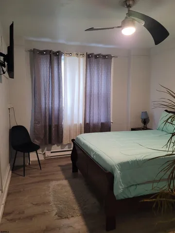 a bedroom with a bed and a chair