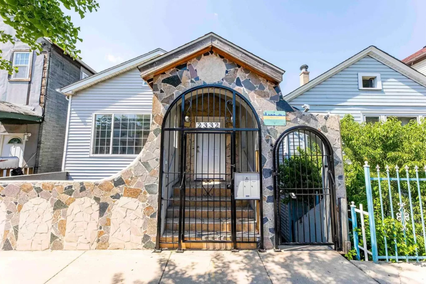 a front view of a house with garden