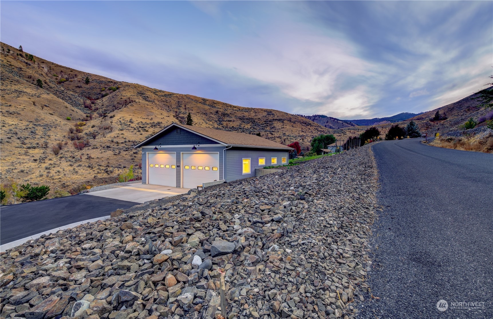 1611 Pitcher Canyon Road Wenatchee, WA 98801 - Photo 1 of 20 a view of a dry yard with wooden fence