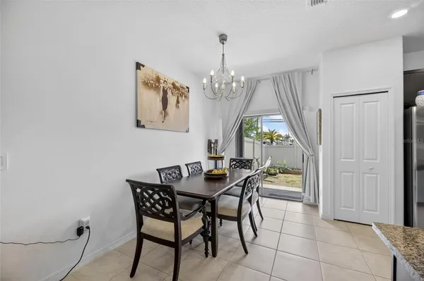 a kitchen with stainless steel appliances granite countertop a refrigerator and a stove