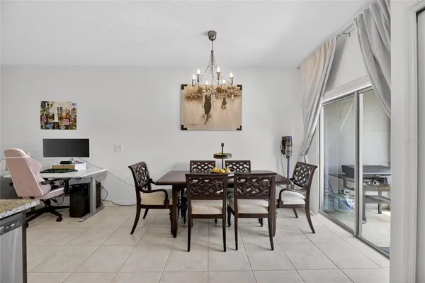 a kitchen with stainless steel appliances granite countertop a sink and a refrigerator