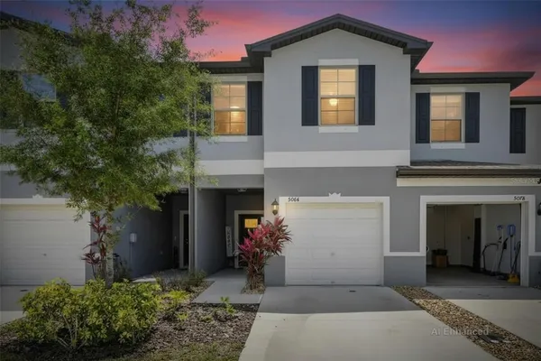 a front view of a house with a garage