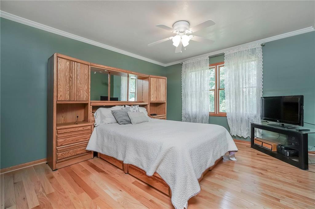 563 Leeper Road Georgetown, PA 15043 - Photo 12 of 25 Generous sized Master bedroom overlooking the expansive backyard. The perfect spot for rest and relaxation.