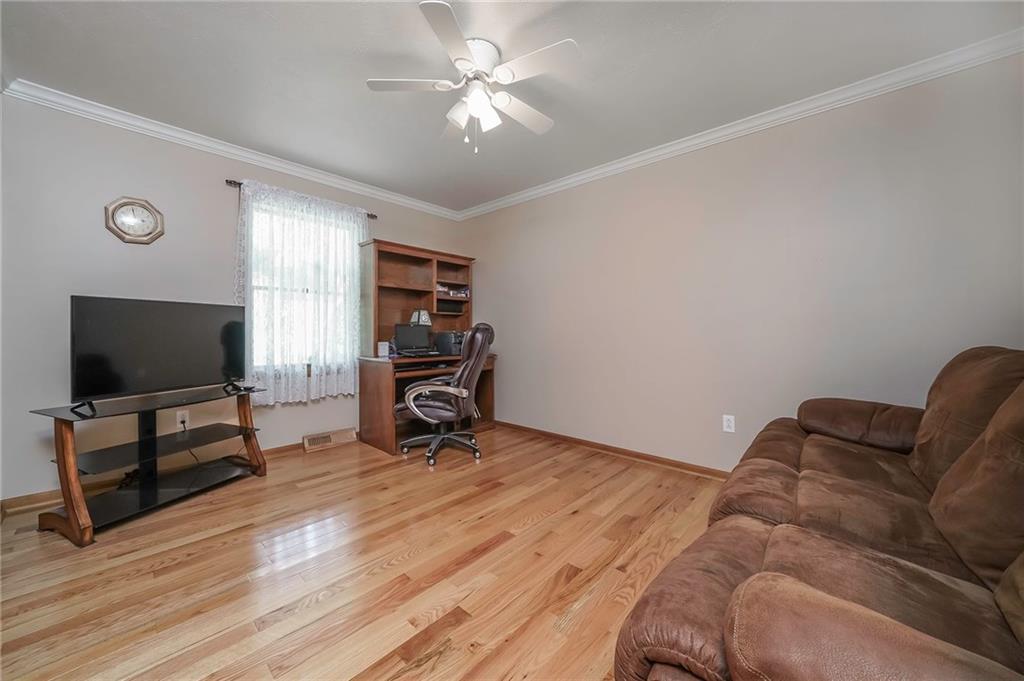 563 Leeper Road Georgetown, PA 15043 - Photo 14 of 25 Another main floor bedroom features hardwoods, crown molding, ceiling fan and double closet as well.