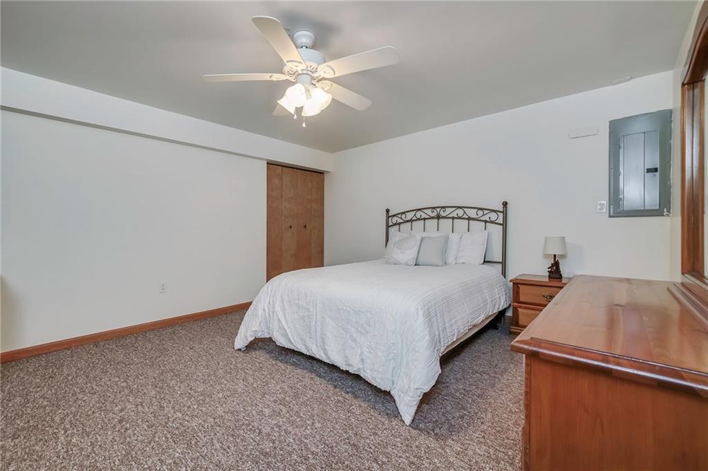 563 Leeper Road Georgetown, PA 15043 - Photo 17 of 25 Large 4th bedroom on the lower level with walk-in closet an ceiling fan.