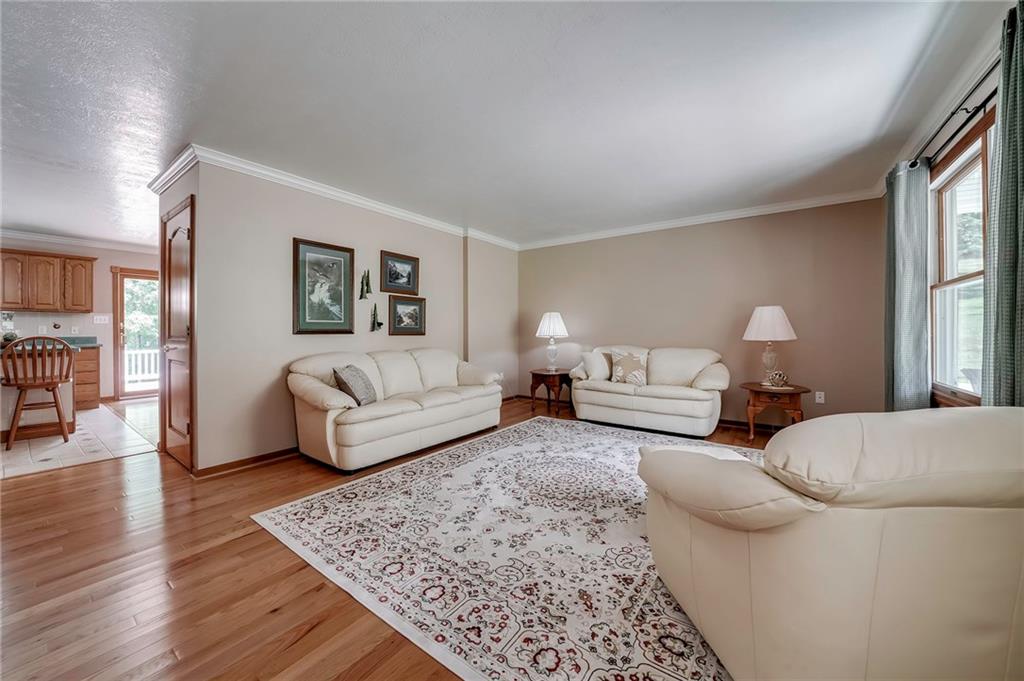 563 Leeper Road Georgetown, PA 15043 - Photo 3 of 25 Gleaming hardwood floors, picture window and crown molding are highlighted in the Living Room.