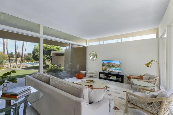 a living room with furniture and a flat screen tv
