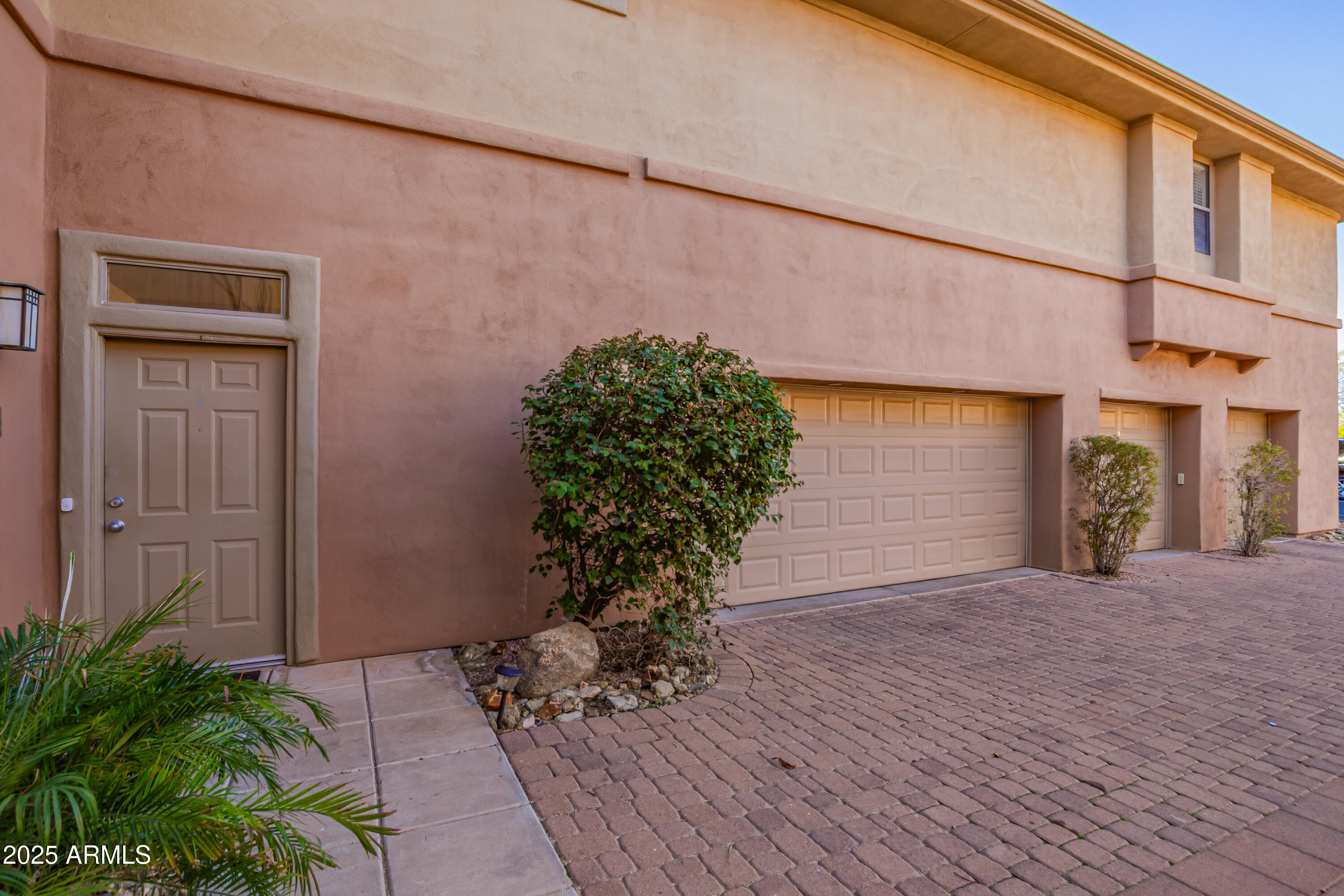 19777 North 76th Street, Unit 1337 Scottsdale, AZ 85255 - Photo 21 of 33 a view of a house with a yard and potted plants