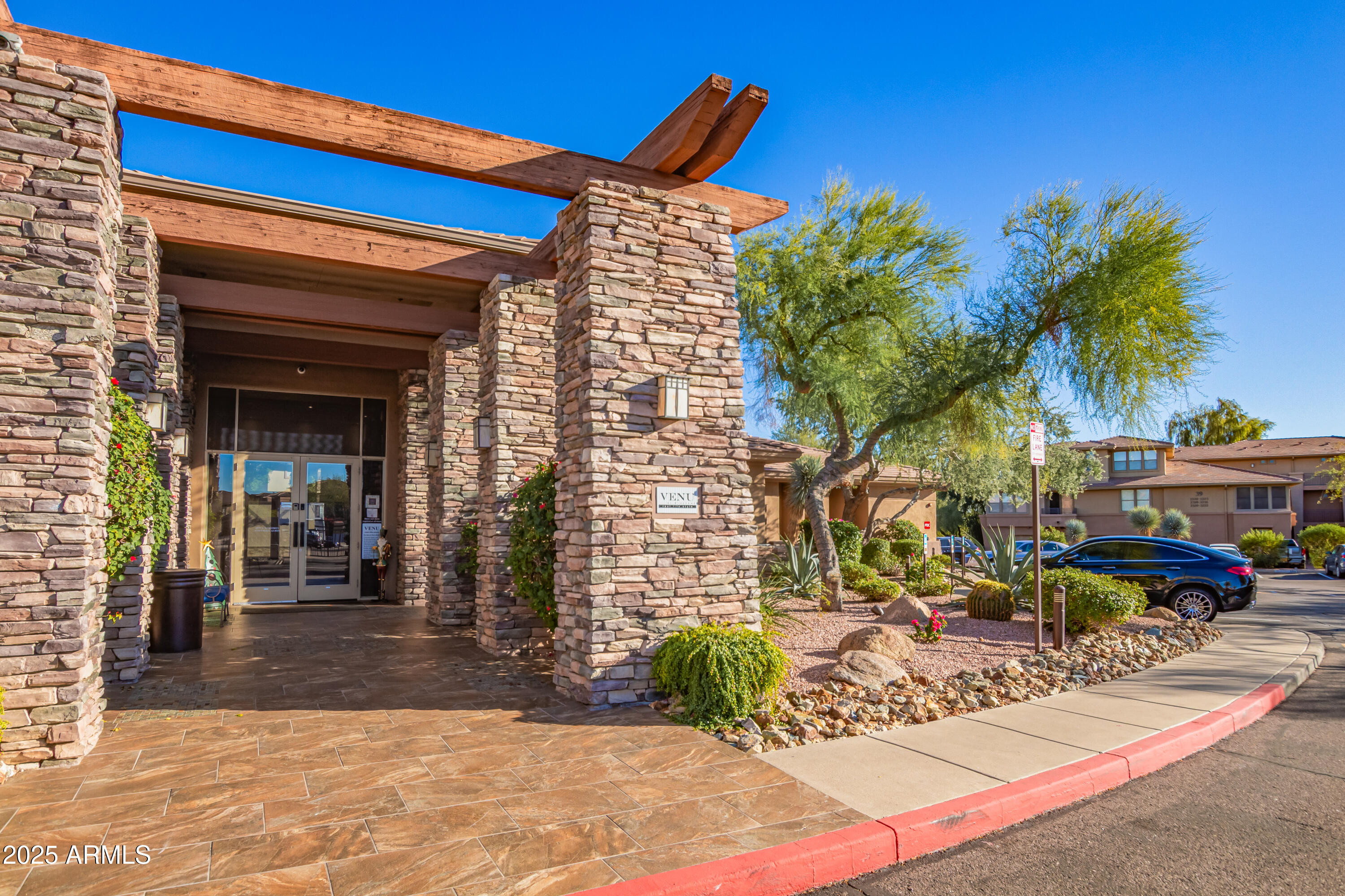 19777 North 76th Street, Unit 1337 Scottsdale, AZ 85255 - Photo 32 of 33 a front view of a building with garden