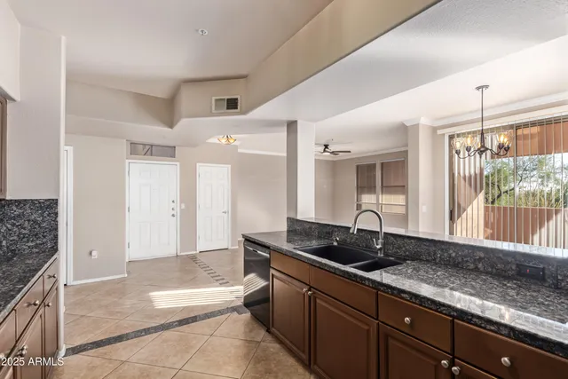 a view of a livingroom with a fireplace and window