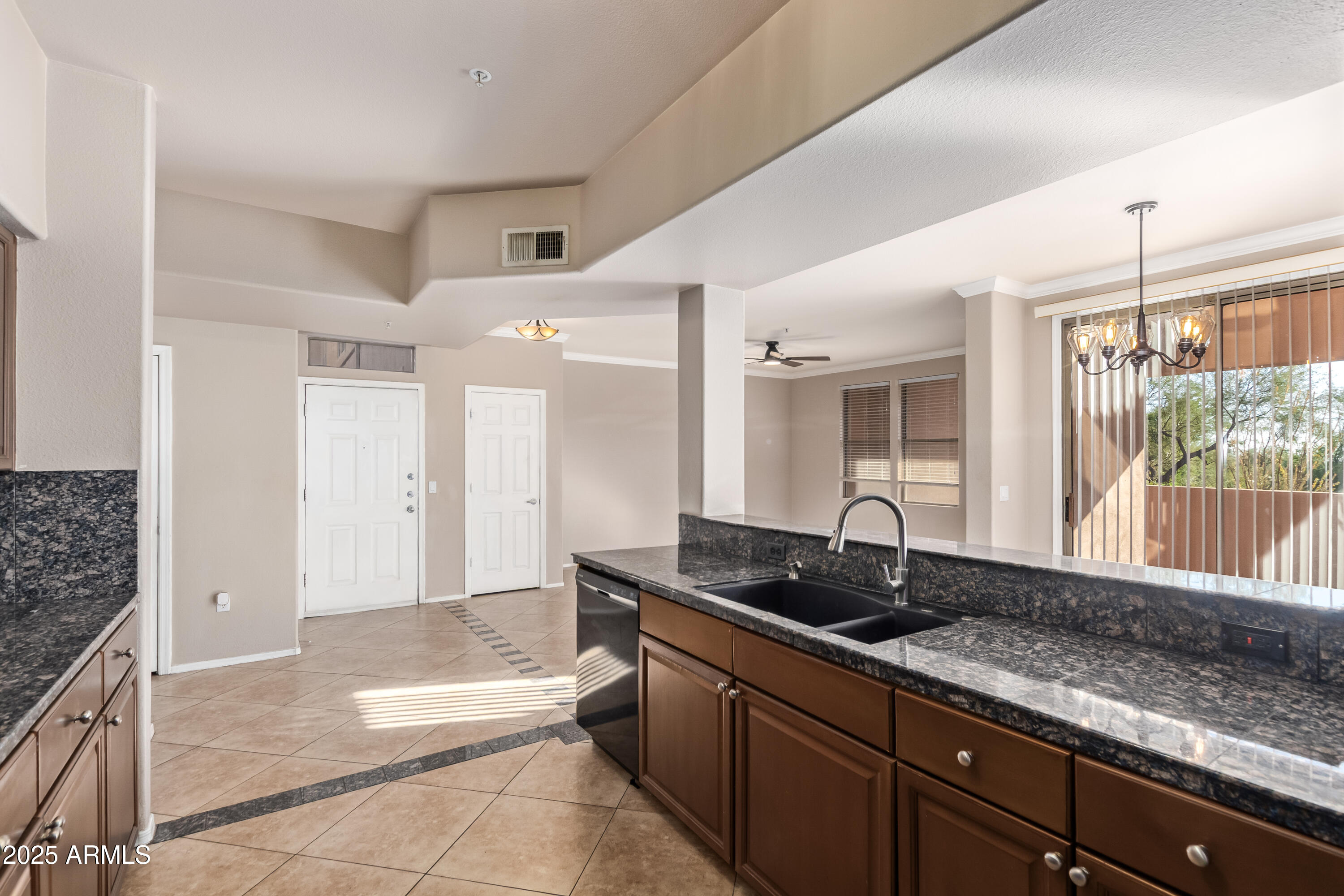19777 North 76th Street, Unit 1337 Scottsdale, AZ 85255 - Photo 8 of 33 a kitchen with granite countertop a sink and a counter top space