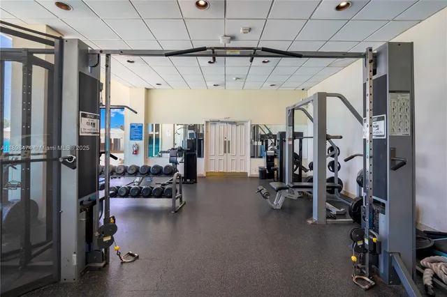 a gym room with lots of chairs and projector room