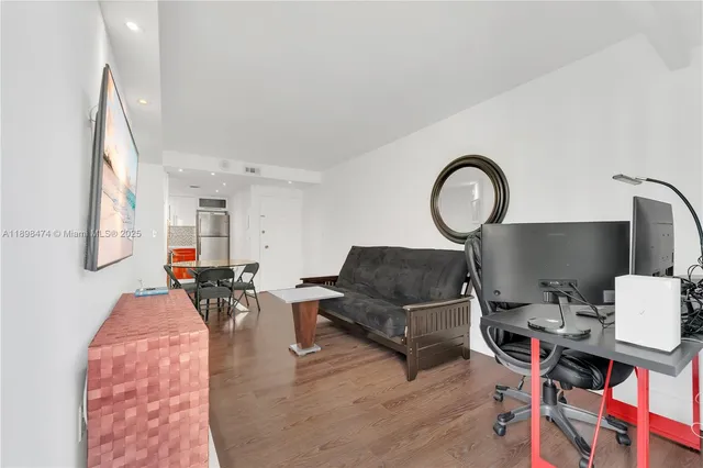 a dining room with furniture and wooden floor