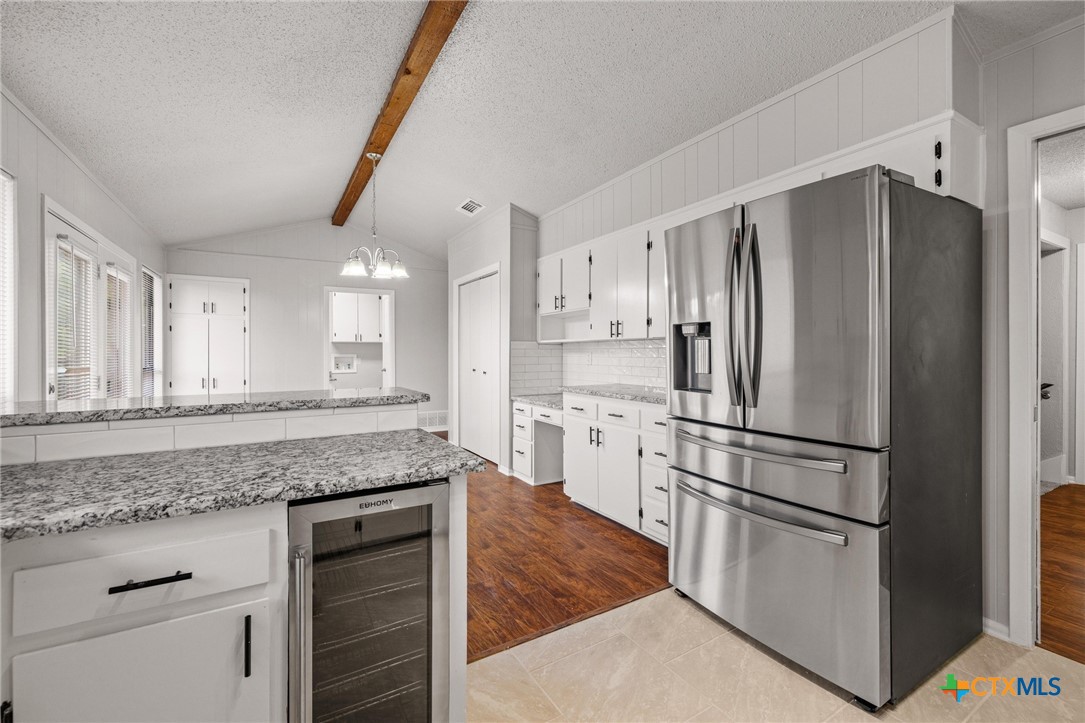 1120 Old Mill Road Salado, TX 76571 - Photo 13 of 42 a kitchen with stainless steel appliances granite countertop a refrigerator a stove and a sink