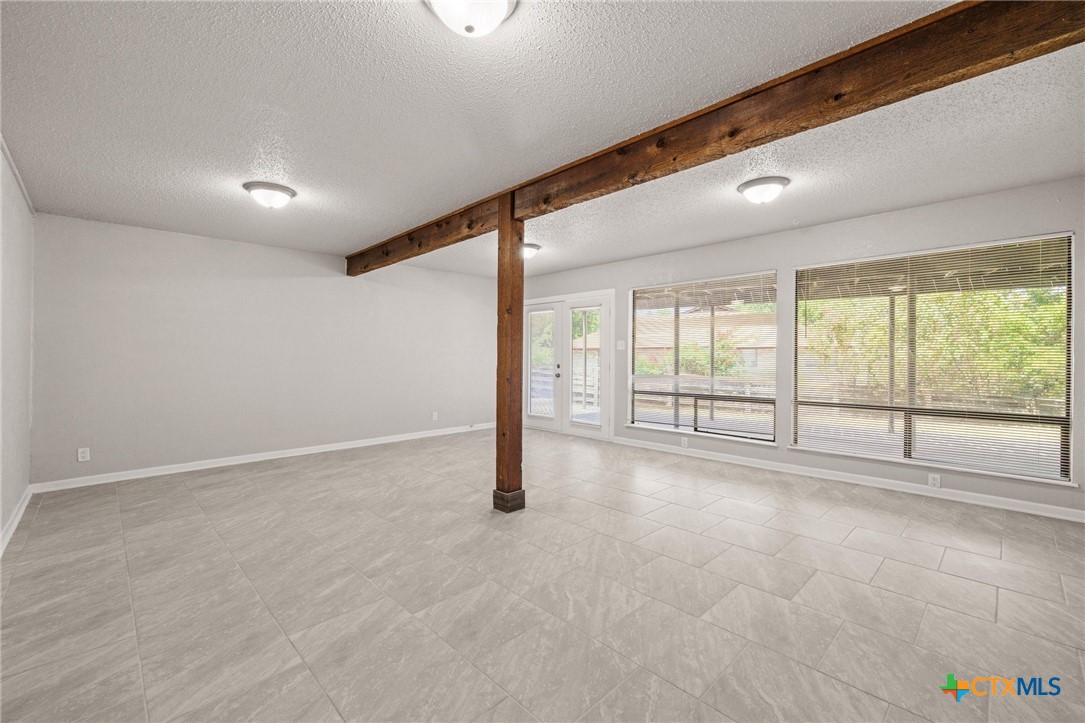 1120 Old Mill Road Salado, TX 76571 - Photo 24 of 42 a view of an empty room with a window
