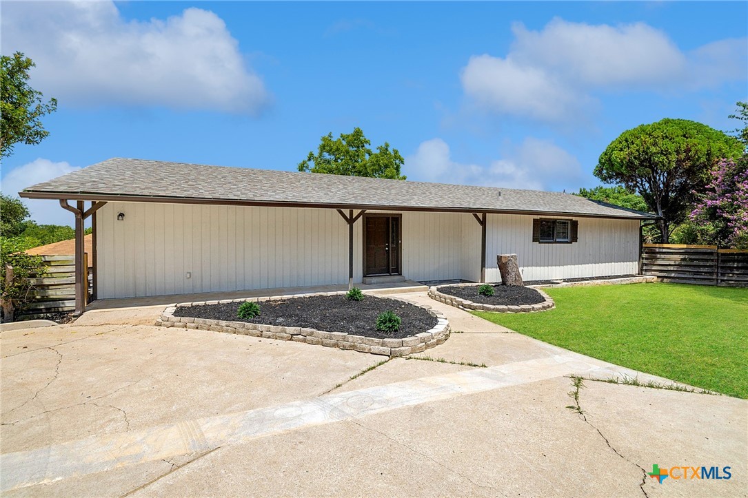 1120 Old Mill Road Salado, TX 76571 - Photo 4 of 42 a front view of a house with a yard and garage