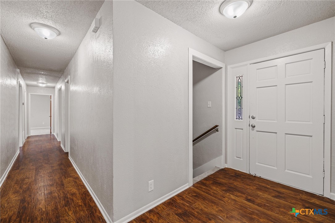 1120 Old Mill Road Salado, TX 76571 - Photo 7 of 42 a view of a hallway with wooden floor