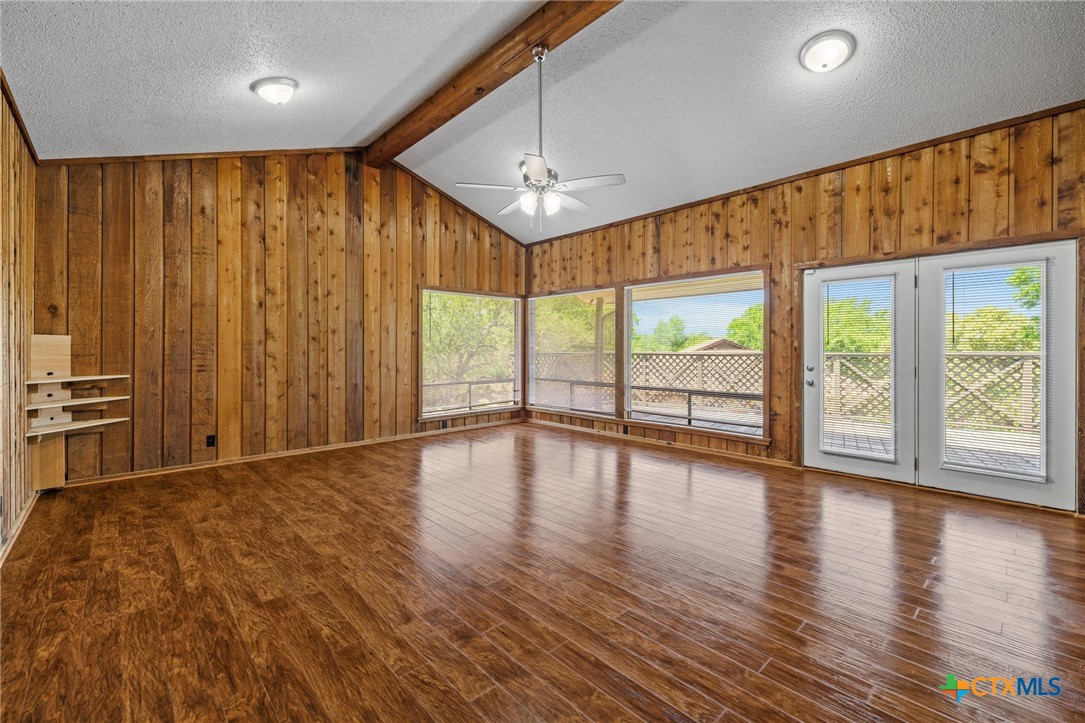 1120 Old Mill Road Salado, TX 76571 - Photo 8 of 42 wooden floor in an empty room with a window