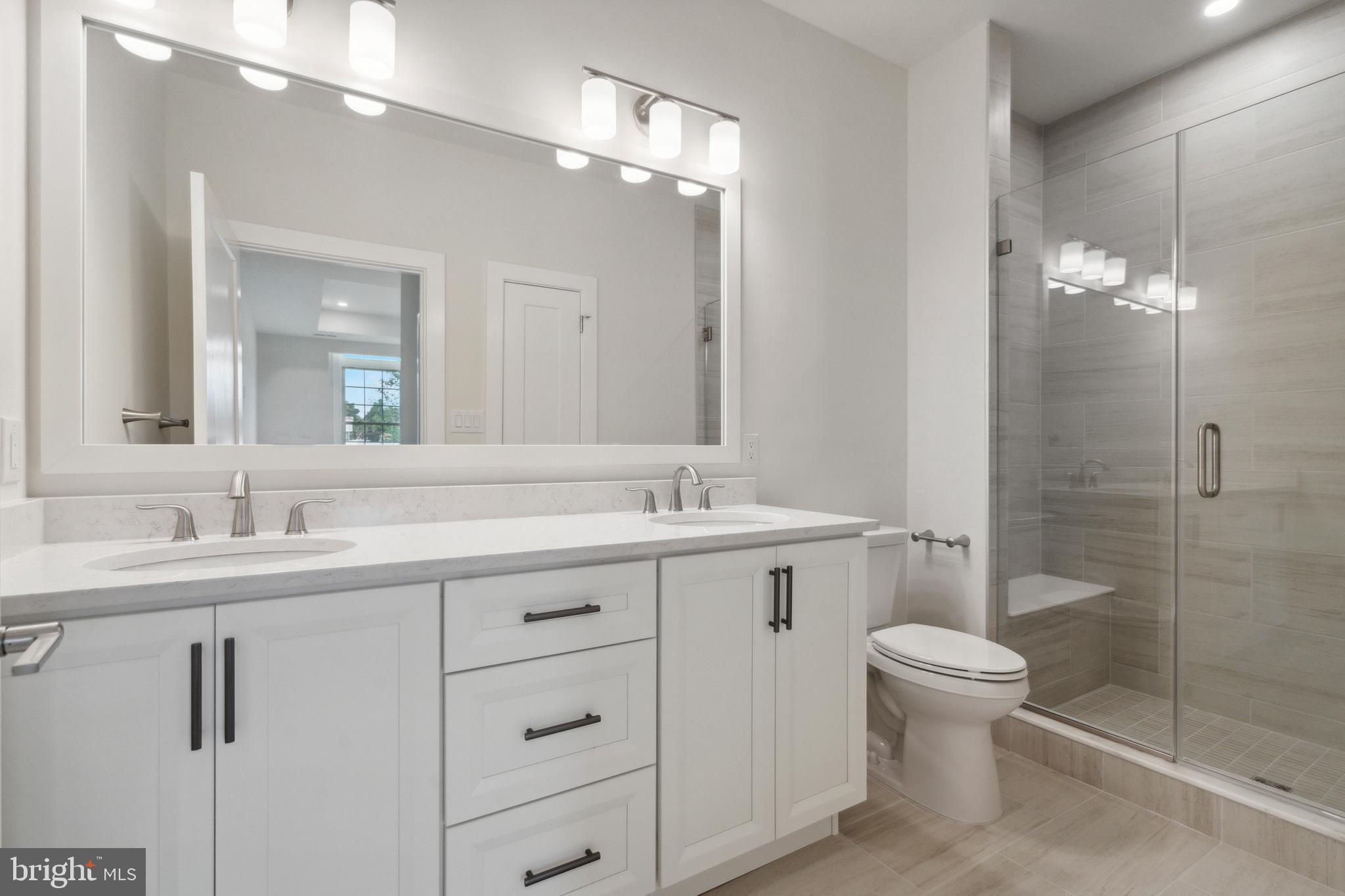 503 Fullerton Farm, Unit 29 Warrington, PA 18976 - Photo 14 of 19 a bathroom with a double vanity sink toilet and shower