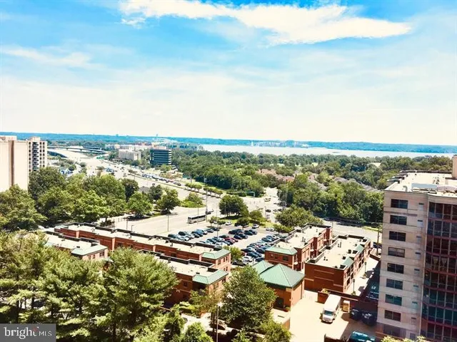 an aerial view of a city with lots of residential buildings in ocean
