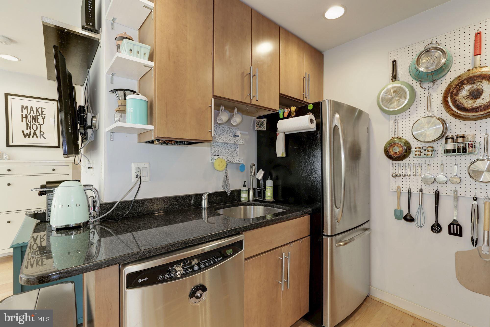 449 R Street Northwest, Unit 10 Washington, DC 20001 - Photo 11 of 23 a kitchen with stainless steel appliances granite countertop a refrigerator a stove and a sink