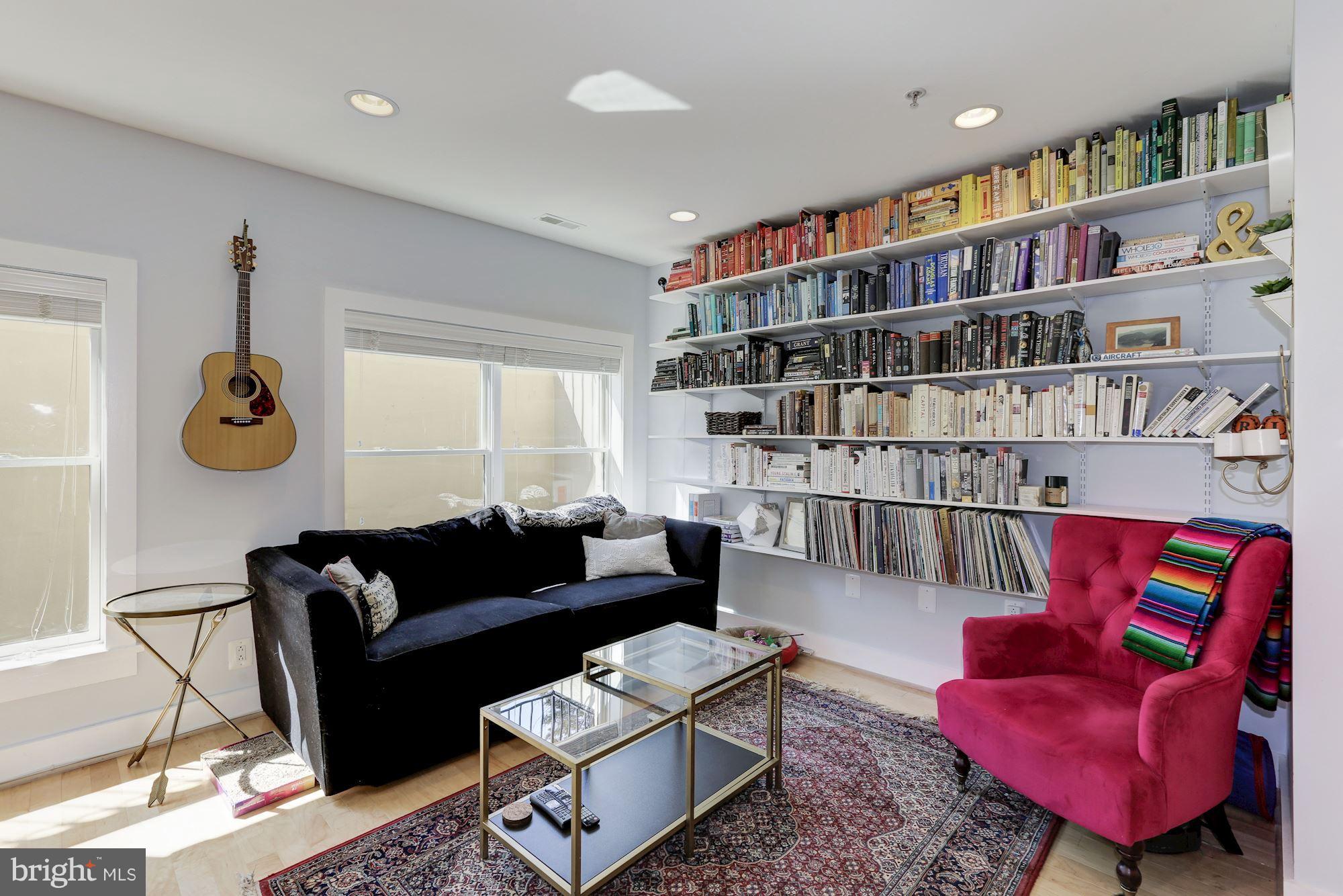 449 R Street Northwest, Unit 10 Washington, DC 20001 - Photo 5 of 23 a living room with furniture cabinets and a book shelf