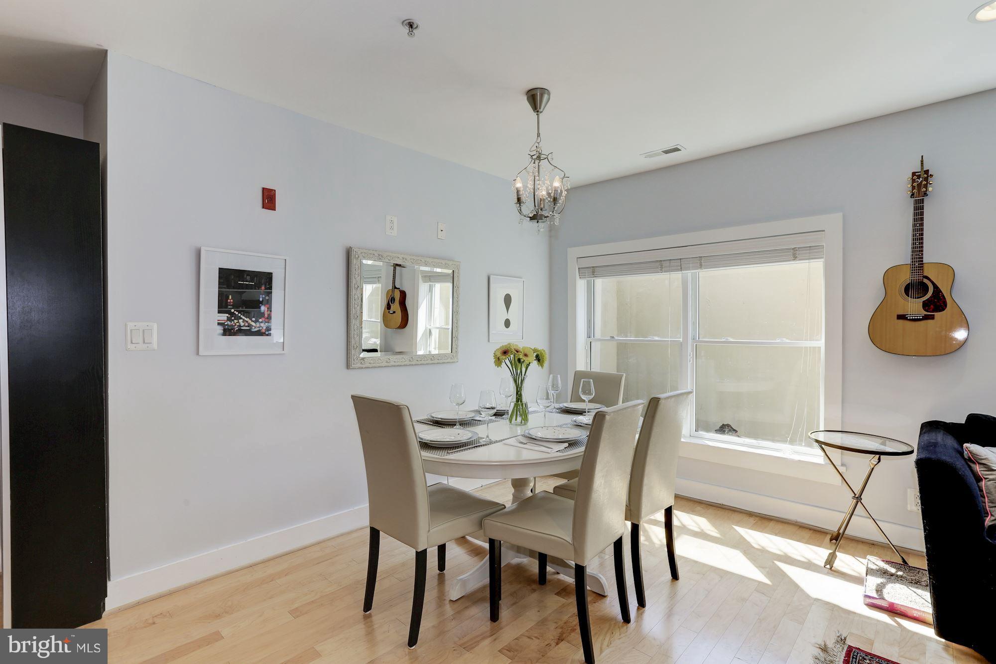 449 R Street Northwest, Unit 10 Washington, DC 20001 - Photo 8 of 23 a view of a dining room with furniture and a window