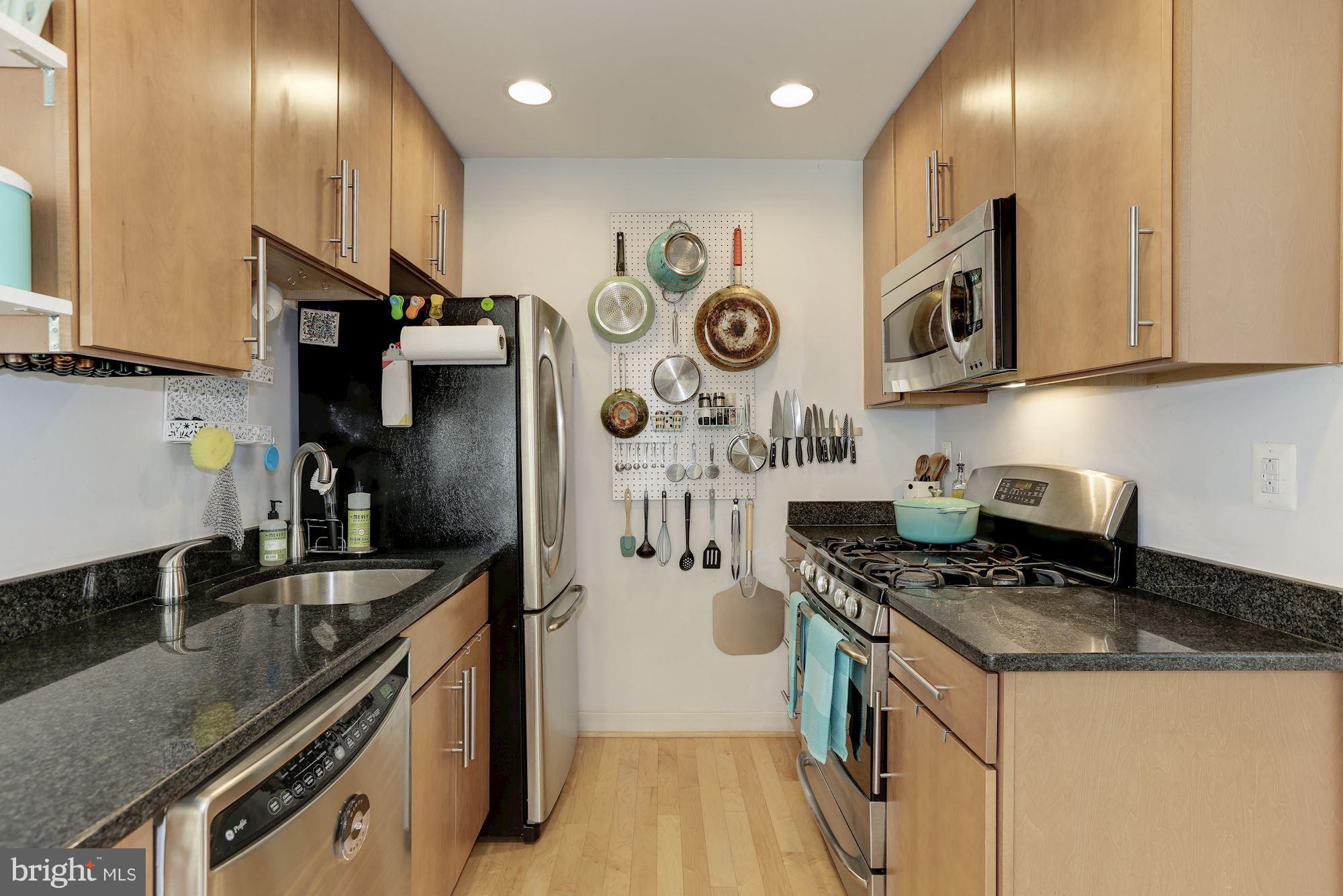 449 R Street Northwest, Unit 10 Washington, DC 20001 - Photo 9 of 23 a kitchen with stainless steel appliances granite countertop a sink a stove and a refrigerator