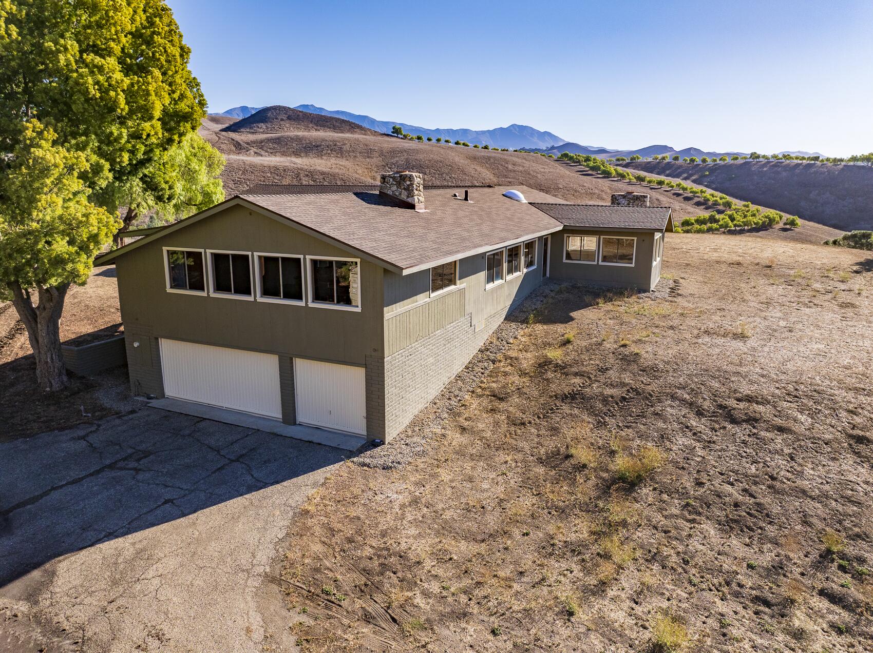 1959 Rambling Oaks Road Santa Ynez, CA 93460 - Photo 15 of 42 a front view of a house with a yard
