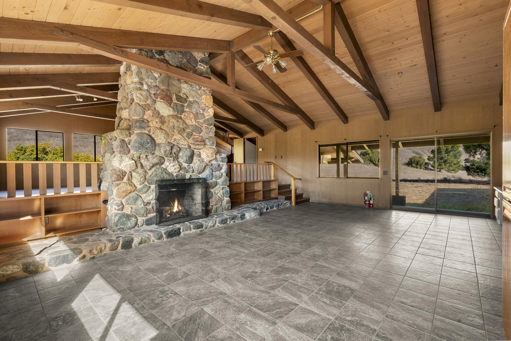 1959 Rambling Oaks Road Santa Ynez, CA 93460 - Photo 17 of 42 a view of a hall with couch