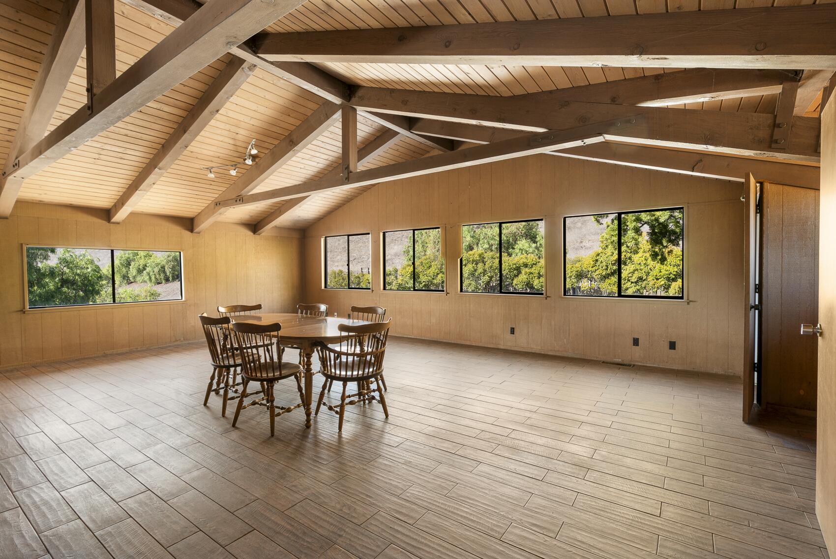 1959 Rambling Oaks Road Santa Ynez, CA 93460 - Photo 19 of 42 a view of a patio with table and chairs