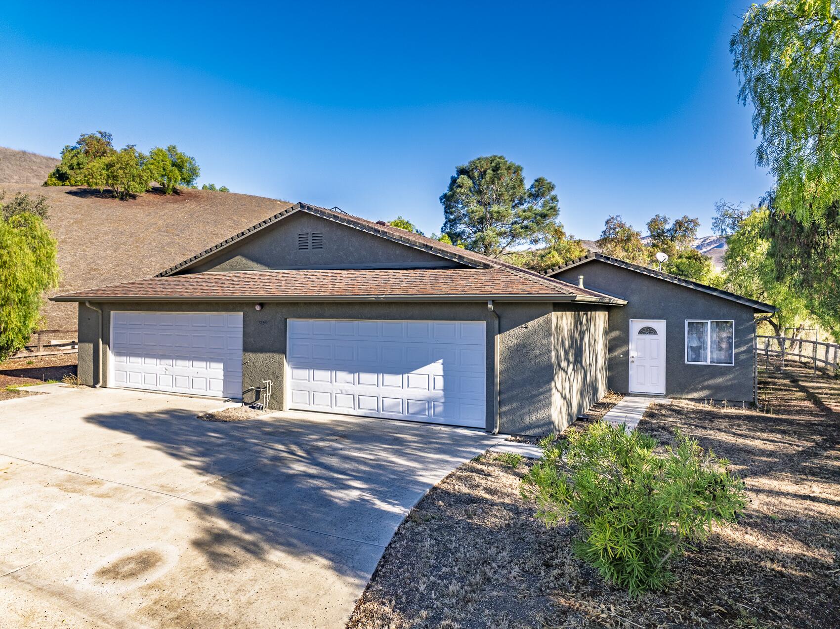 1959 Rambling Oaks Road Santa Ynez, CA 93460 - Photo 30 of 42 a front view of a house with a yard