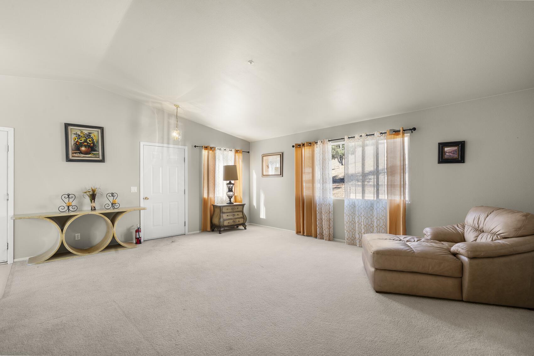 1959 Rambling Oaks Road Santa Ynez, CA 93460 - Photo 33 of 42 a living room with furniture and a window