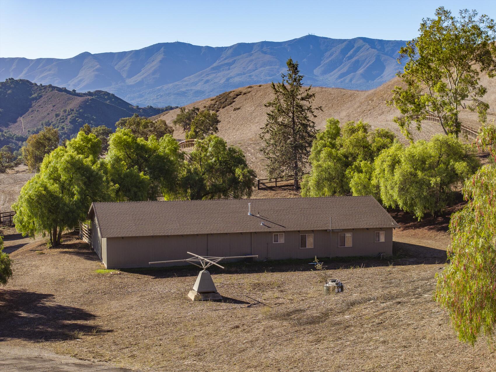 1959 Rambling Oaks Road Santa Ynez, CA 93460 - Photo 39 of 42 a view of a house with a yard and street