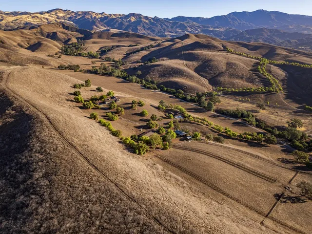 a view of a city with mountains in the background