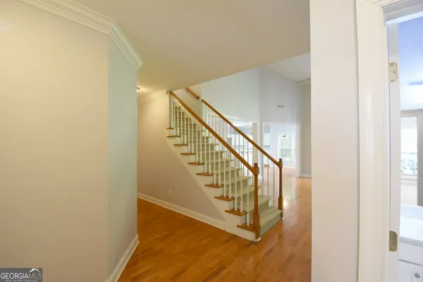 a view interior of a house a floor to ceiling window and entryway