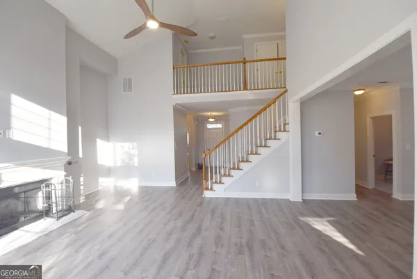 a kitchen with kitchen island a sink a counter top space stainless steel appliances and cabinets