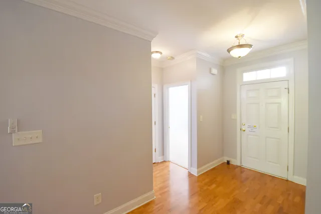 an empty room with wooden floor