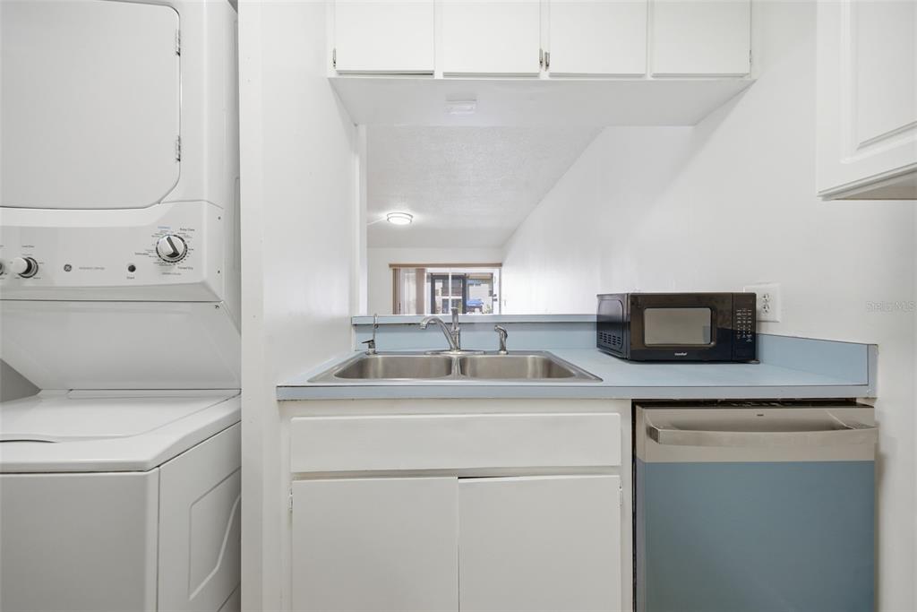 141 Fernery Road, Unit A3 Lakeland, FL 33809 - Photo 8 of 40 a kitchen with a sink and a stove top oven
