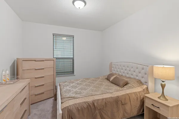 a bedroom with a bed and a cabinets