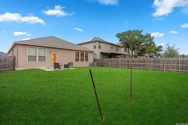 a front view of a house with a yard porch and garden