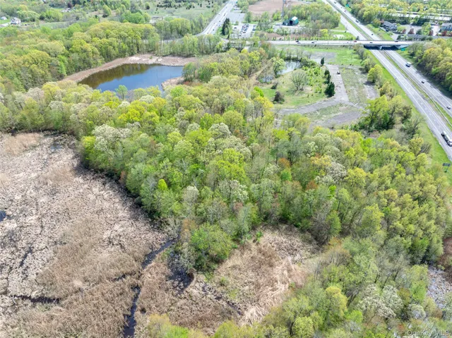 an aerial view of a houses with outdoor space and street view