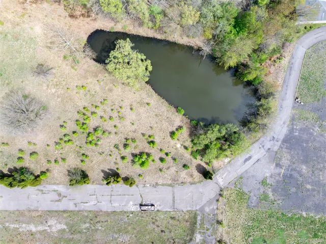 a view of a road with a yard