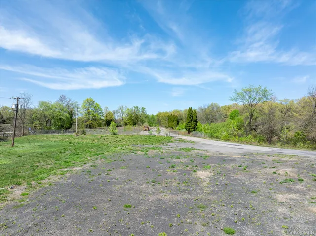 a view of an outdoor space with field and trees