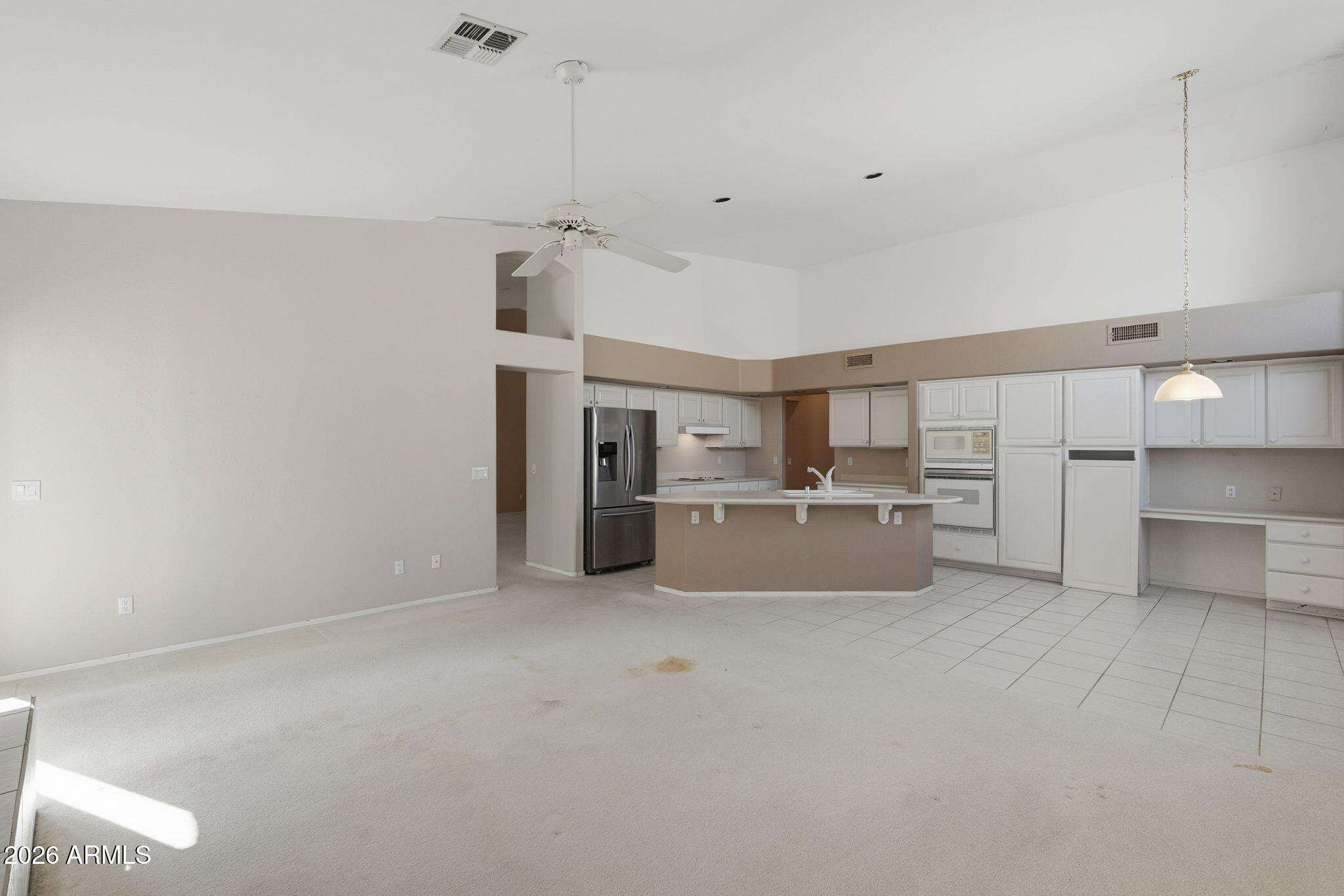 16651 South 18th Way Phoenix, AZ 85048 - Photo 12 of 43 a large white kitchen with cabinets and a sink