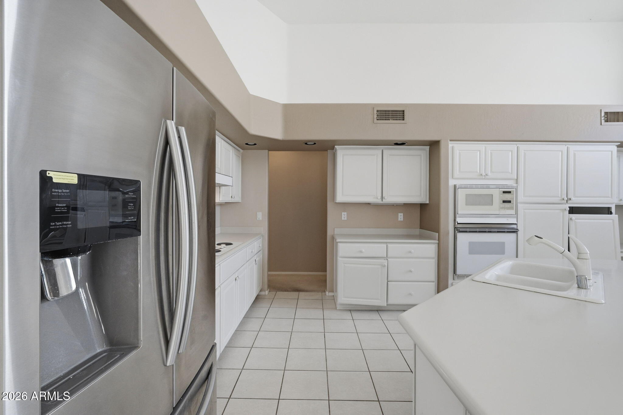 16651 South 18th Way Phoenix, AZ 85048 - Photo 13 of 43 a kitchen with a refrigerator sink and cabinets