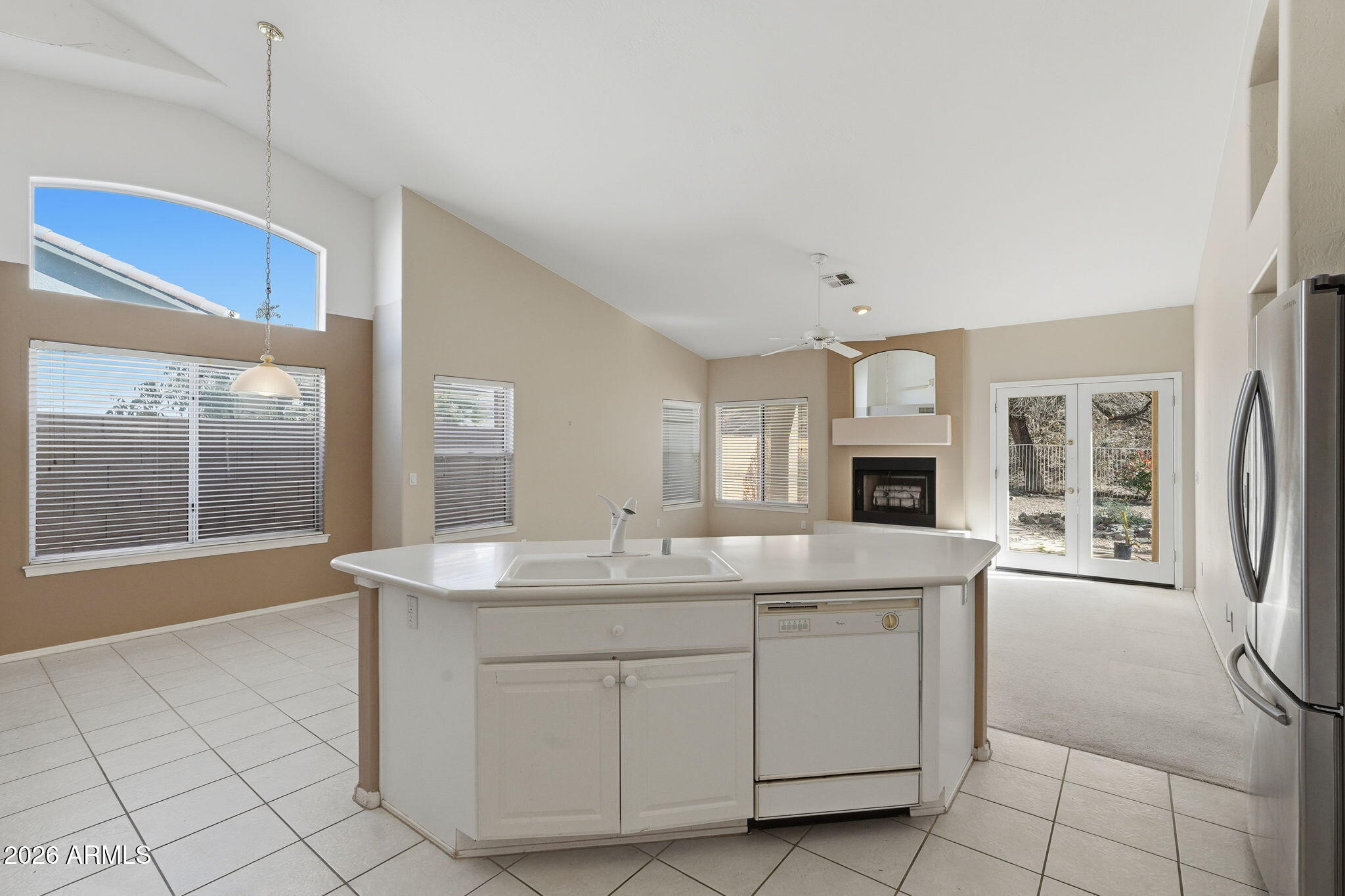16651 South 18th Way Phoenix, AZ 85048 - Photo 15 of 43 a kitchen with a sink stove and cabinets