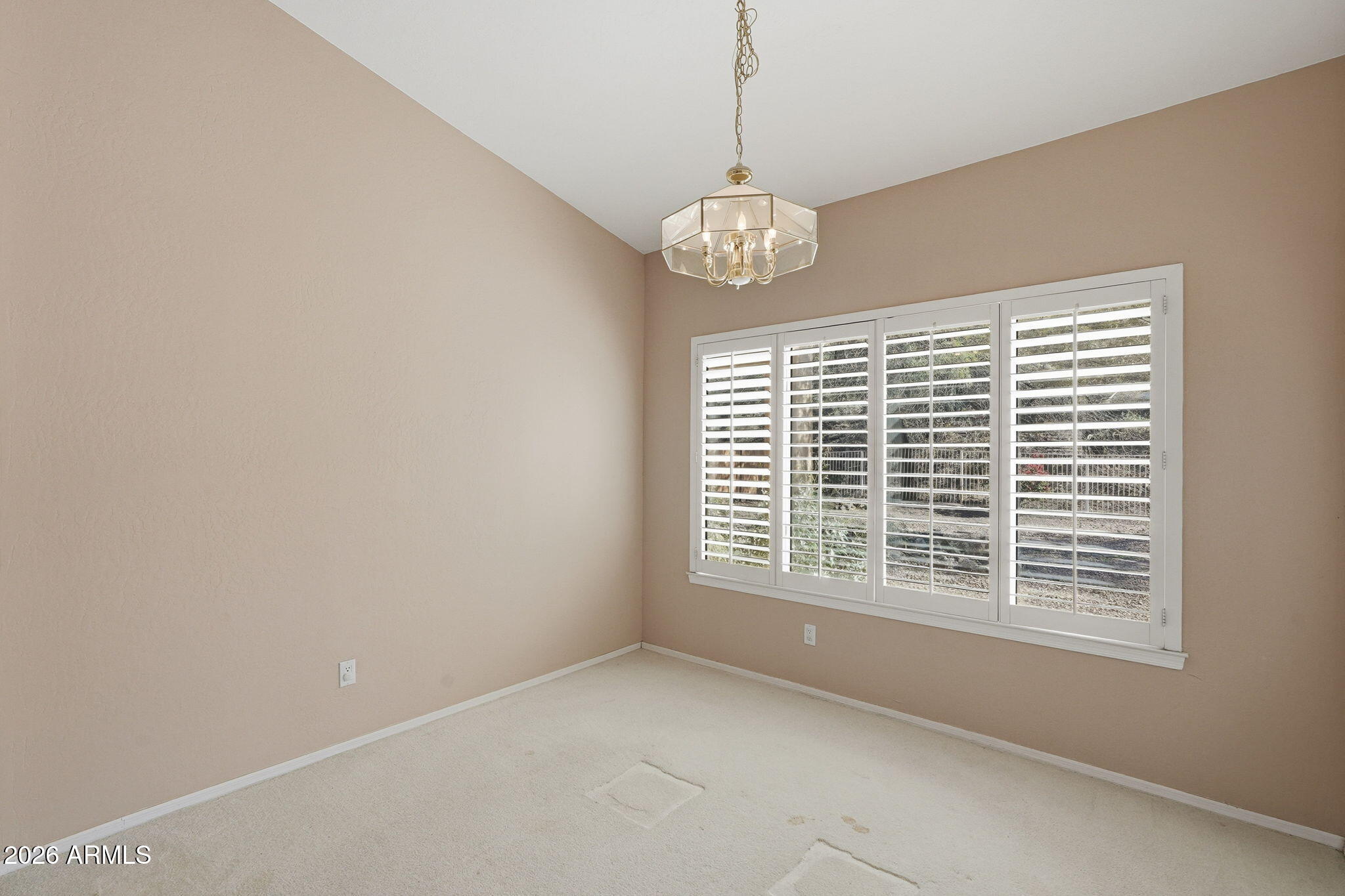 16651 South 18th Way Phoenix, AZ 85048 - Photo 20 of 43 a view of a livingroom with a chandelier and a window