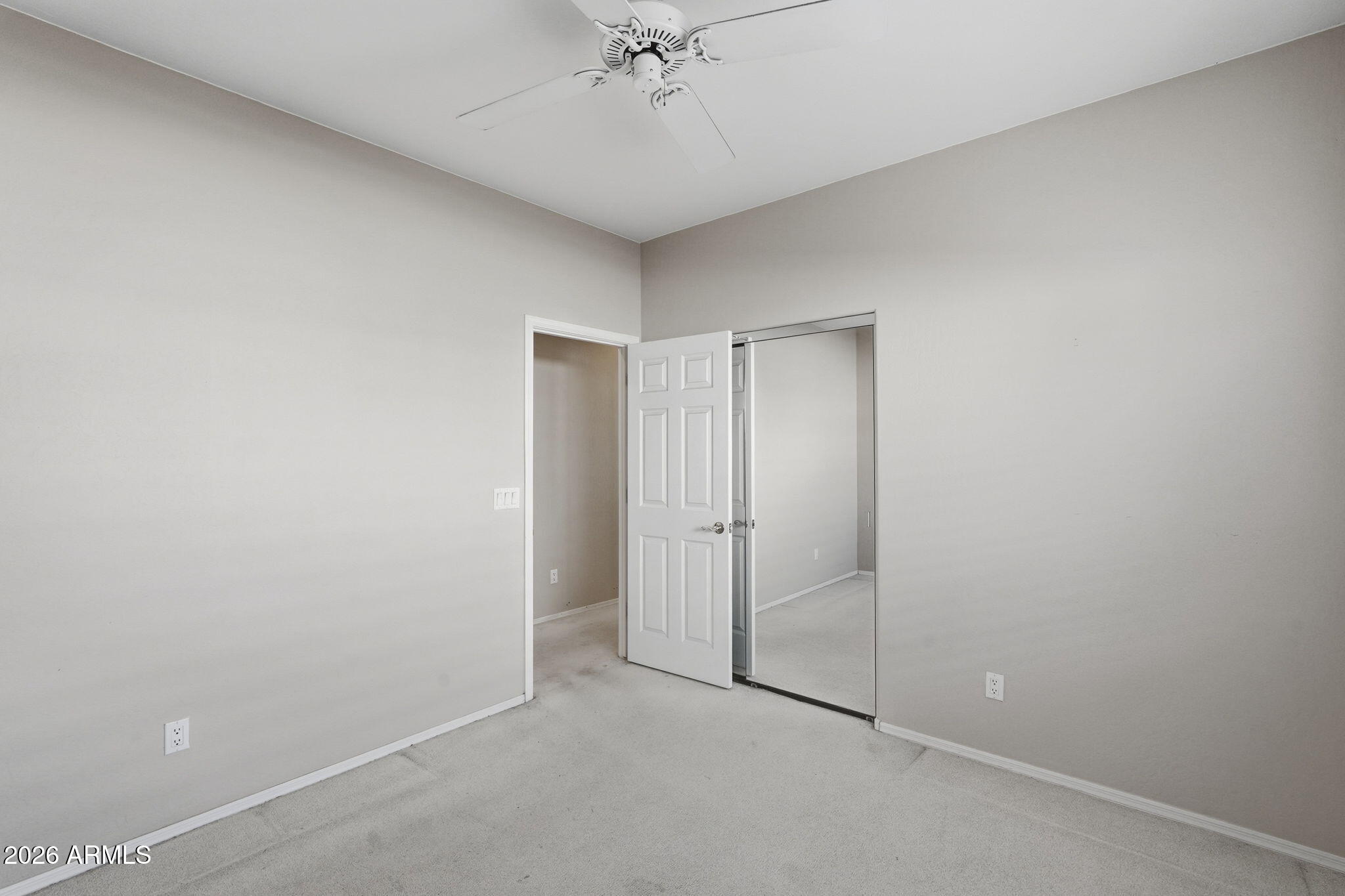 16651 South 18th Way Phoenix, AZ 85048 - Photo 23 of 43 a view of a room with a ceiling fan and closet area