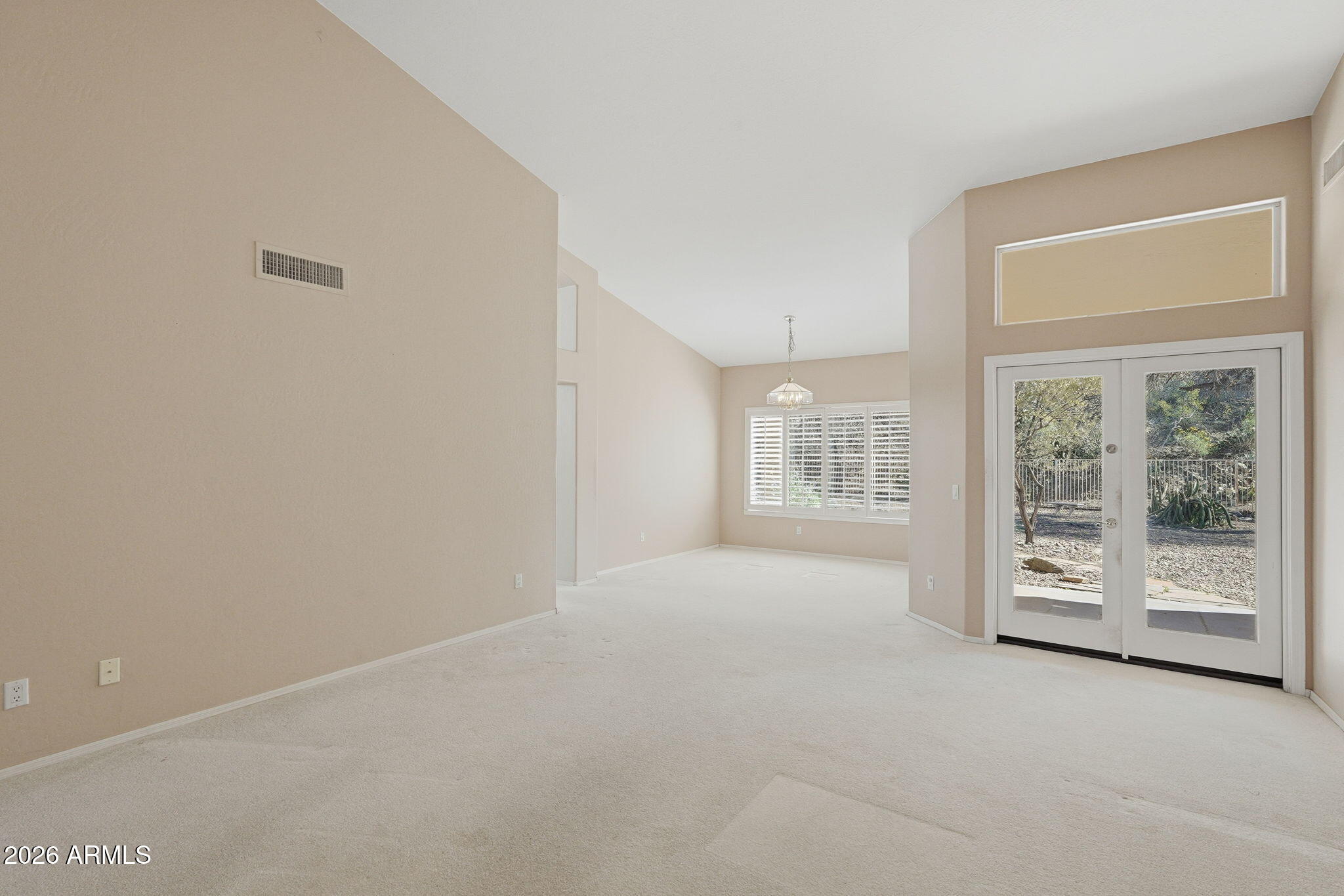 16651 South 18th Way Phoenix, AZ 85048 - Photo 9 of 43 a view of a big room with windows and entryway of the house
